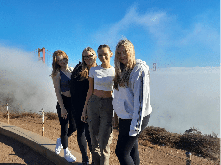Image of four students in front of Golden Gate Bridge
