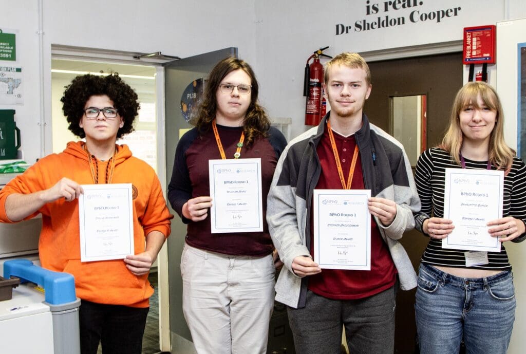 Image of Physics students with certificates