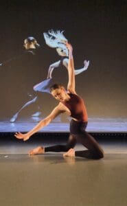 Image is of student Ava Moseley dancing in the Costello Theatre at Priestley College.