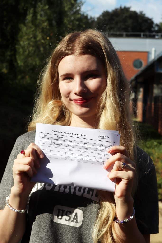 Student holding exam results sheet on Results Day 2026 at Priestley College.