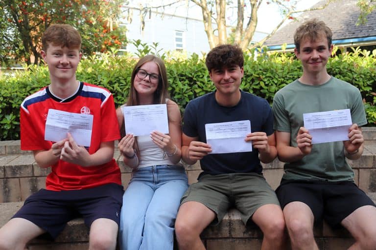 Students celebrating Results Day 2026 at Priestley College with exam results.